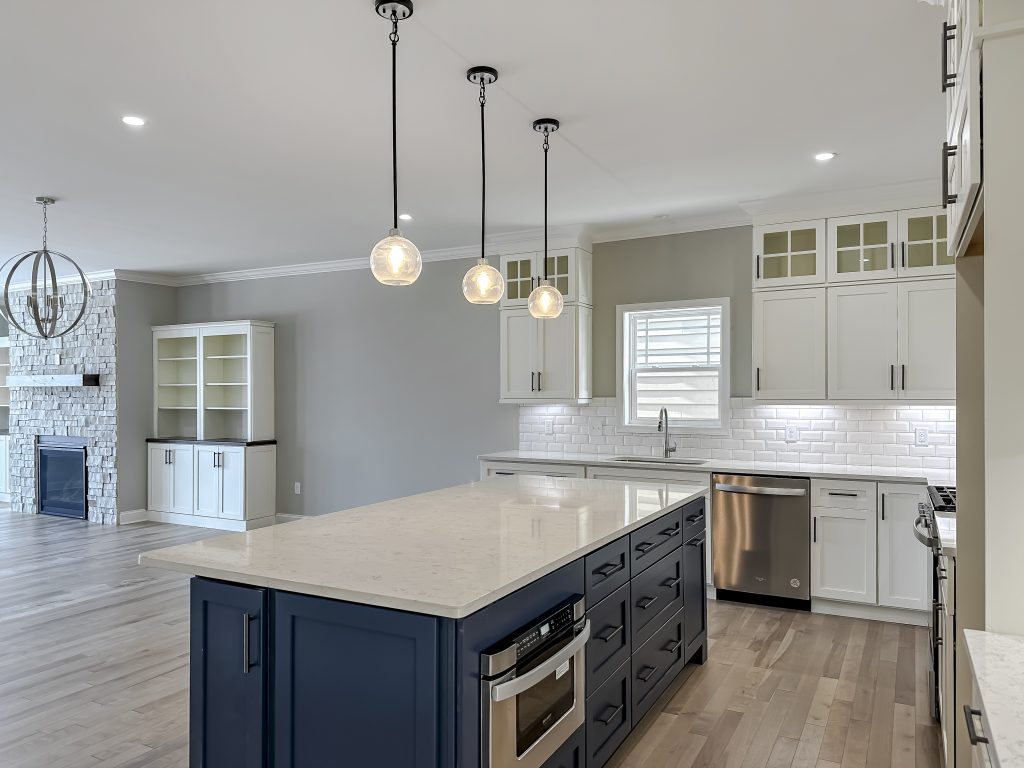 Kitchen with quartz countertops, pendant lighting and center island