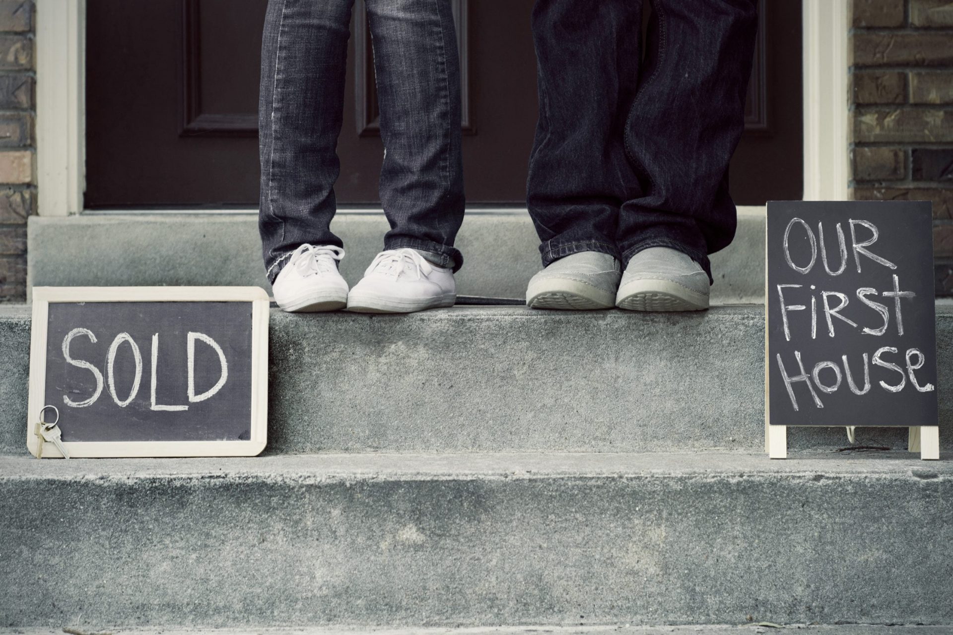 Couple feet in front of new home.