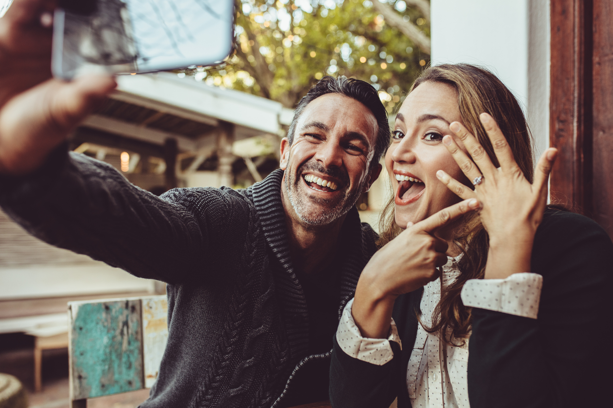 Beautiful engaged couple making selfie