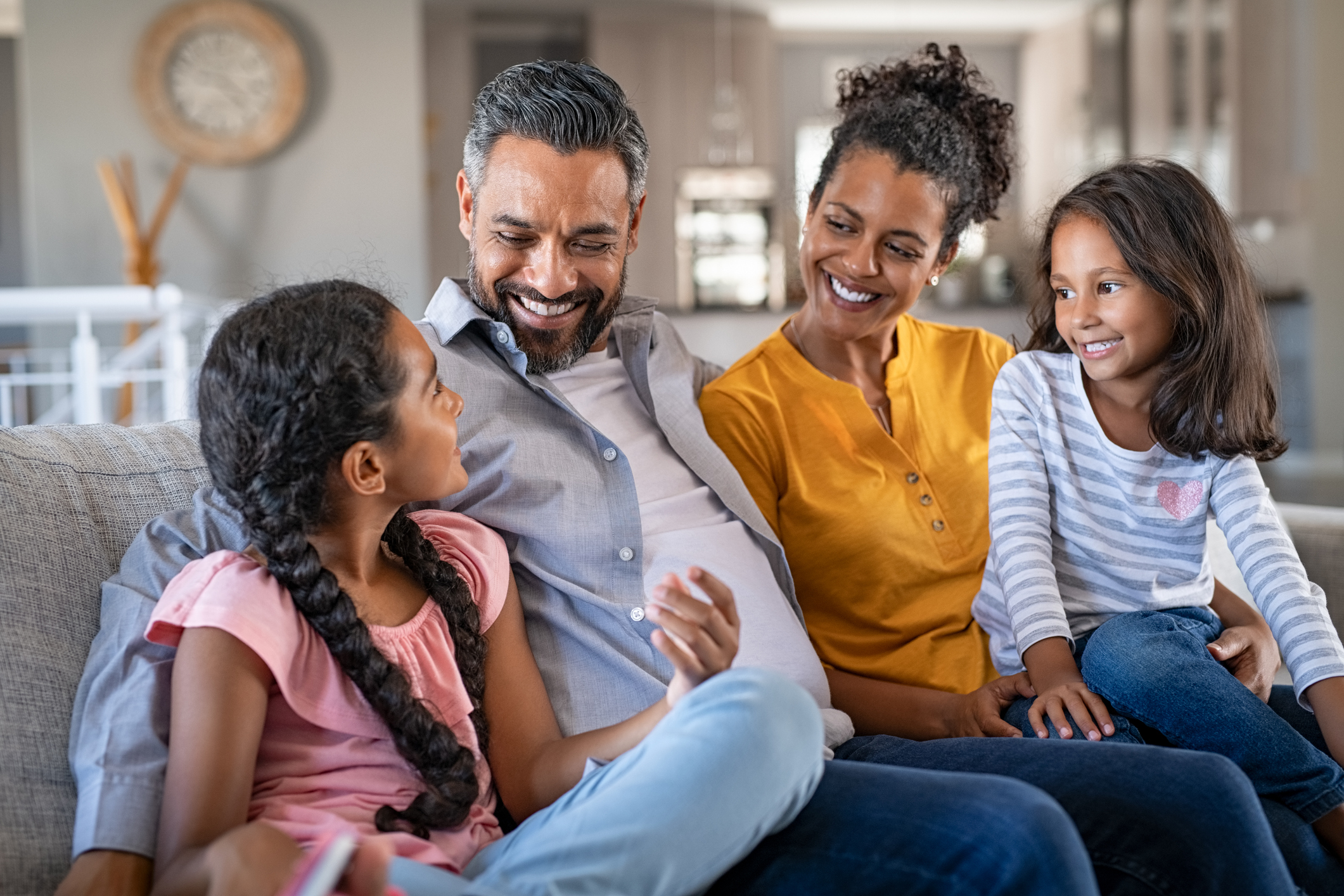 Happy joyful mixed race family having fun together