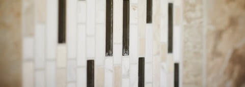 Tan and black ceramic wall tile detail