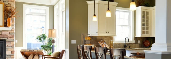 Three hanging pendant lights over kitchen bar area