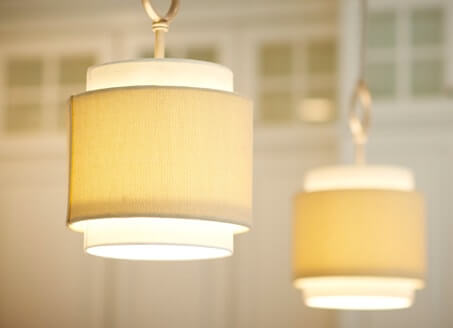 Two hanging pendant lights with double shades